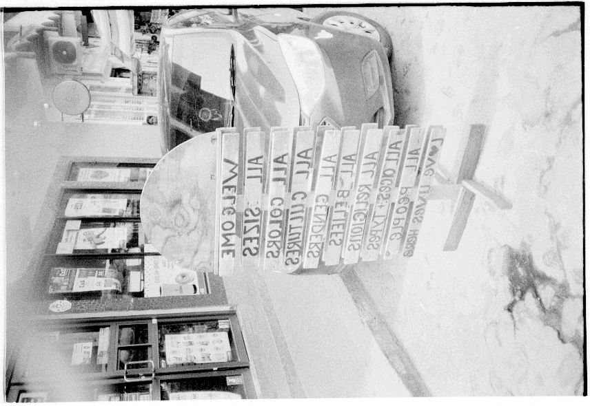 a negative scan of a welcoming sign from a small town in Mexico
